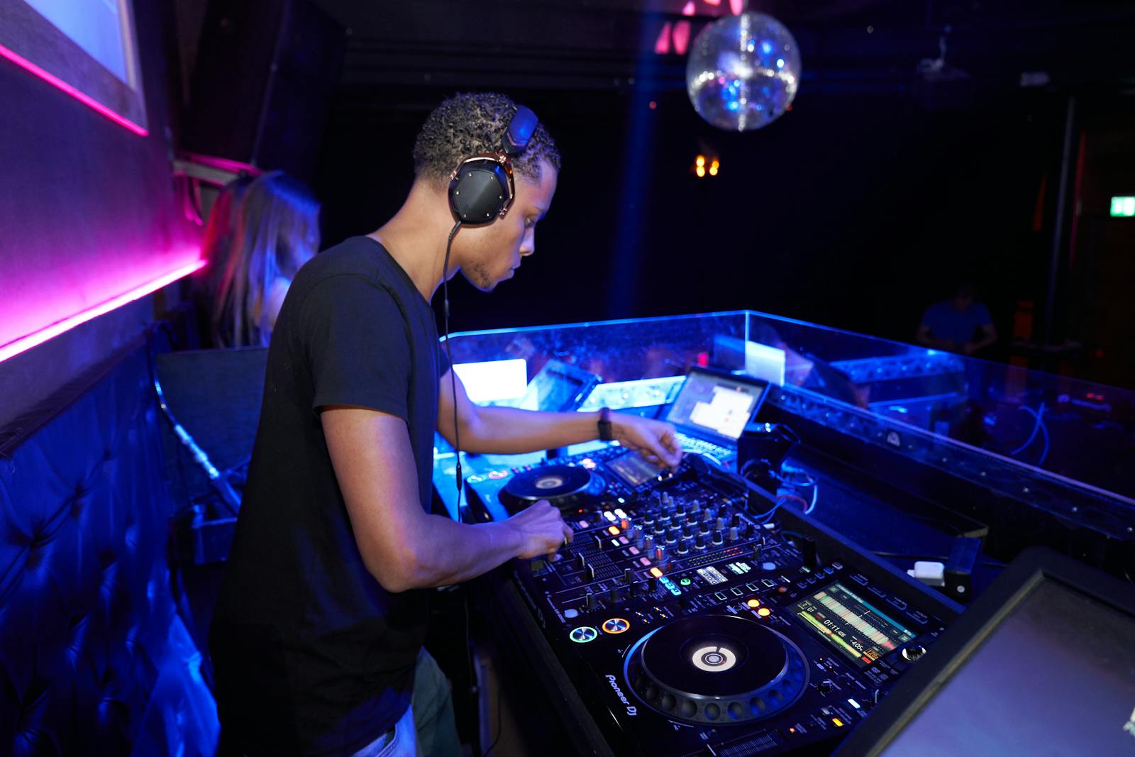 Man Wearing Black Crew-neck Shirt Playing Dj Turntable